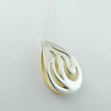 Load image into Gallery viewer, tear shaped hollow pendant with cut out flames backed with brass