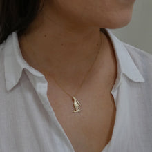 Load image into Gallery viewer, Woman wearing solid gold hare pendant with 9 carat gold chain