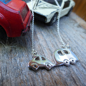 matchbox cars with silver adventurers necklace