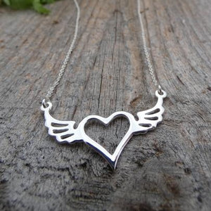 silver necklace with heart and wings