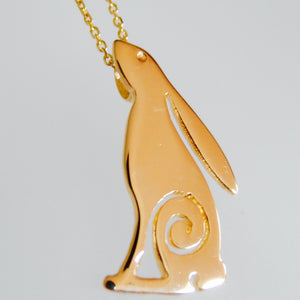 solid gold hare pendant with Celtic spiral